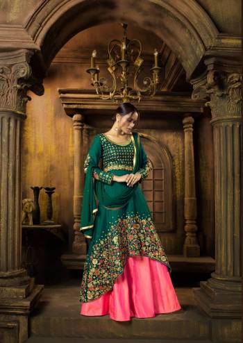 Look Beautiful Wearing This Designer Indo-Western Suit In Pine Green Colored Top Paired With Contrasting Pink Colored Lehenga And Pine Green Dupatta. Its Top And Lehenga Are Fabricated On Art Silk Paired With Chiffon Dupatta. It Is Beautified With Detailed Embroidery All Over The Top.