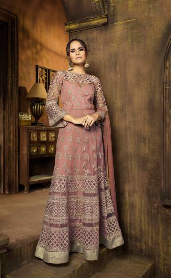 Look Pretty In This Designer Floor Length Suit In Dusty Pink Color Paired With Dusty Pink Colored Bottom And Dupatta. Its Top Is Fabricated On Net Paired With Chiffon Dupatta. It Is Light Weight And Easy To Carry All Day Long. Buy Now.