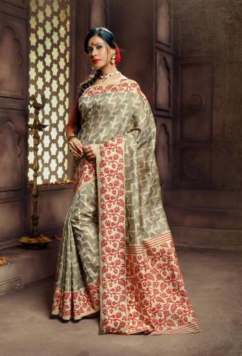 Get Ready For The Next Formal Function At Your Place With This Lovely Saree In Grey Color Paired With Contrasting Red Colored Blouse. This Saree And Blouse Are Fabricated On Banarasi Art Silk Which Gives A Rich Look To Your Personality. Buy This Saree Now.