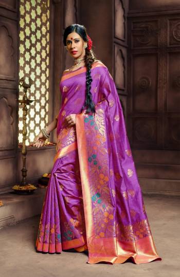 Attract All Wearing This Saree In Purple Color Paired With Purple Colored Blouse. This Saree And Blouse Are Fabricated On Banarasi Art Silk Beautified With Weave All Over. This Saree Will Definitely Earn You Lots Of Compliments From Onlookers.