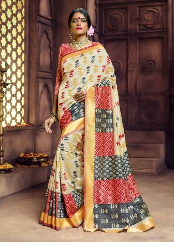 Flaunt Your Rich And Elegant Taste Wearing This Rich Looking Saree In Beige Color Paired With Contrasting Red Colored Blouse. This Saree And Blouse Are Fabricated On Banarasi Art Silk Beautified With Weave All Over. Buy This Rich Looking Saree Now.