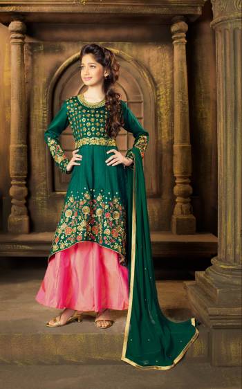 Another Indo-Western Suit For Your Sweet Angel Is Here In Pine Green Colored Top Paired With Contrasting Pink Colored Lehenga And Pine Green Colored Dupatta. Its Top And Lehenga Are Fabricated On Art Silk Paired With Chiffon Dupatta. Buy It Now.