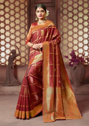 Adorn The Royal Queen Look Wearing This Saree In Maroon Color Paired With Golden And Maroon Colored Blouse. This Saree And Blouse are fabricated On Banarasi Art Silk. Buy This Saree Now.