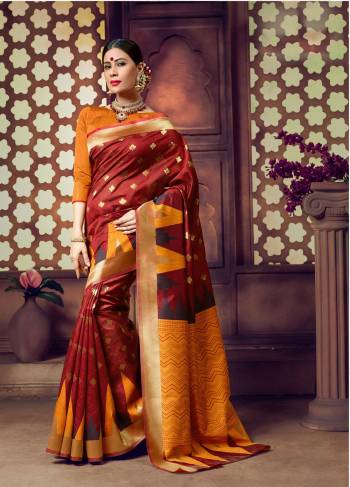 Adorn The Royal Queen Look Wearing This Saree In Maroon Color Paired With Rust Orange Colored Blouse. This Saree And Blouse are fabricated On Banarasi Art Silk. Buy This Saree Now.