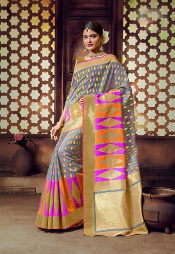 Flaunt Your Rich And Elegant Taste Wearing This Saree In Grey Color Paired With Golden Colored Blouse. This Saree And Blouse Are Fabricated On Banarasi Art Silk Beautified With Multi Colored Weave. Buy This Saree Now.