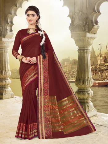 Adorn The Royal Look Wearing This Saree In Maroon Color Paired With Maroon Colored Blouse. This Saree And Blouse Are Fabricated On Cotton Silk Beautified With Weave Over The Border. This Saree Is Light In Weight And Easy To Carry All Day Long.