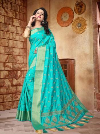 Get Ready For The Coming Festive Season Wearing This Saree In Turquoise Blue Color Paired With Beige Colored  Blouse. This Saree Is Fabricated On Sof Silk Paired With Art Silk Fabricated Blouse. Its Pretty Color And Rich Fabric Will Earn You Lots Of Compliments From Onlookers.