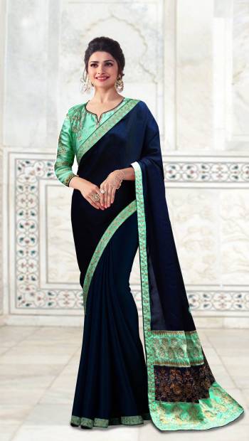 This Wedding Season, Flaunt Your Rich and Elegant Taste With Minimum Embroidered Designer Saree In Green Color Paired With Contrasting Navy Blue Colored Blouse. This Saree Is Fabricatred On Soft Silk Paired With Art Silk Fabricated Blouse. It Is Light Weight And Easy To Carry All Day Long.