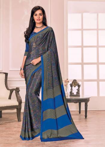 Grab This Saree In Blue Color Paired With Blue Colored Blouse. This Saree And Blouse Are Fabricated On Crepe Beautified With Intricate Prints All Over It. 