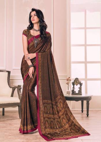 Enhance Your Beauty Wearing this Saree In Brown Color Paired With Brown Colored Blouse. This Saree And Blouse Are Fabricated On Crepe Beautified With Intricate Prints All Over. Buy This Saree Now.