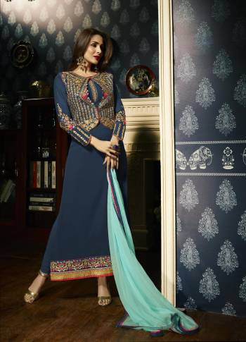 For An Attractive Personality, Grab This Designer Straight Cut Suit In Blue Color Paired With Blue Colored Bottom And Contrasting Sky Blue Colored Dupatta. Its Top Is Fabricated On Georgette Paired With Santoon Bottom And Chiffon Dupatta. Its Has Embroidery Over the Neckline And Panel With Embroidred Jacket. 