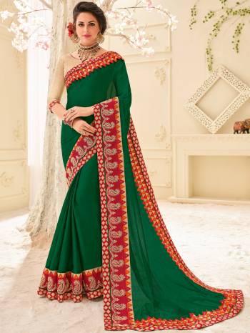 you Look striking and stunning afler wearing this Dark green color moss chiffon saree. look gorgeous at an upcoming any occasion wearing the saree. this party wear saree won't fail to impress everyone around you. Its attractive color and designer patch, stone, mirror, floral design work over the attire & contrast hemline adds to the look. Comes along with a contrast unstitched blouse.