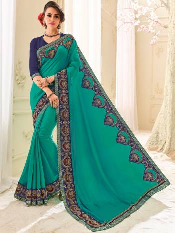 Change your wardrobe and get classier outfits like this gorgeous Turquoise Blue color two tone silk saree. Ideal for party, festive & social gatherings. this gorgeous saree featuring a beautiful mix of designs. Its attractive color and designer patch, stone, floral design work over the attire & contrast hemline adds to the look. Comes along with a contrast unstitched blouse.