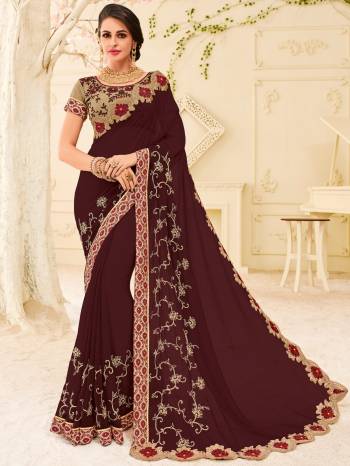 Show your elegance by wearing this gorgeous Dark Wine color Georgette saree. Ideal for party, festive & social gatherings. this gorgeous saree featuring a beautiful mix of designs. Its attractive color and designer patch, stone, floral design work over the attire & contrast hemline adds to the look. Comes along with a contrast unstitched blouse.