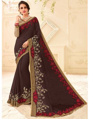 Flaunt your gorgeous look wearing this Dark Grey color bright chiffon saree. Ideal for party, festive & social gatherings. this gorgeous saree featuring a beautiful mix of designs. Its attractive color and designer patch, stone, floral design work over the attire & contrast hemline adds to the look. Comes along with a contrast unstitched blouse.