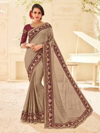 The fabulous pattern makes this saree a classy number to be included in your wardrobe. Light Khaki colored two tone chiffon pattern saree. Ideal for party, festive & social gatherings. this gorgeous saree featuring a beautiful mix of designs. Its attractive color and designer patch, moti, stone, floral design work over the attire & contrast hemline adds to the look. Comes along with a contrast unstitched blouse.