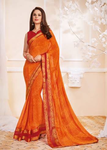 Orange And Red Color Induces Perfect Summery Appeal To Any Outfit So Grab This Saree In Orange Color Paired With Contrasting Red Colored Blouse. This Saree And Blouse Are fabricated On Georgette Which Are Light Weight And Easy To Carry All Day Long.