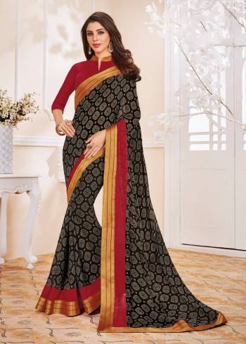 Enhance Your Beauty wearing This Saree In Black Color Paired With Contrasting Maroon Colored Blouse. This Saree And Blouse Are Fabricated On Georgette Beautified With Prints All Over. Buy Now.