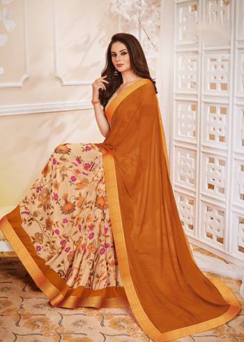 Here Is A Rich Looking Saree In Rust Orange And Beige Color Paired With Beige Colored Blouse. This Saree And Blouse Are Fabricated On Georgette Beautified With Bold Floral Prints. Buy This Saree Now.