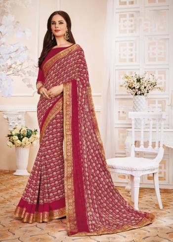 Look Attractive Wearing This Saree In Magenta Pink Color Paired With Magenta Pink Colored Blouse. This Saree And Blouse Are Fabricated On Georgette Beautified With Intricate Prints All Over It.