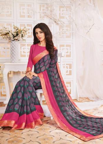 Rich And Elegant Looking Saree Is Here With This Sark Grey Colored Saree Paired With Contrasting Pink Colored Blouse, This Saree And Blouse are Fabricated On Georgette. Buy It Now.