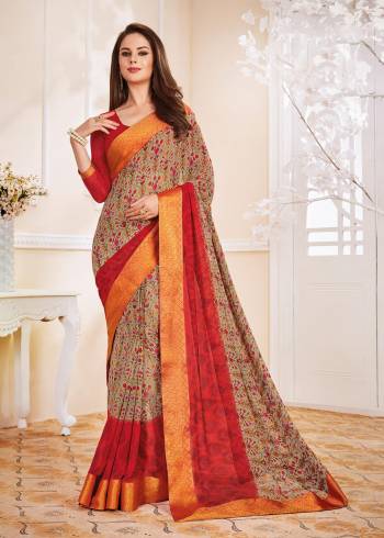 Add Some For Your Casuals With This Saree In Grey Color Paired With Contrasting Red Colored Blouse, This Saree And blouse Are Fabricated On Georgette Beautified With Small Floral Prints All Over It.