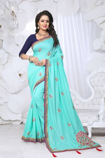 Go With The Shades Of blue With This Pretty Saree In Turquoise Blue Color Paired With Navy Blue Colored Blouse. This Saree Is Fabricated On Soft Silk Paired With Art Silk Fabricated Blouse. Buy This Designer Saree Now.