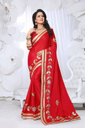 Adorn The Angelic Look Wearing This Saree In Red Color Paired With Red Colored Blouse. This Saree Is Fabricated On Chinon Silk Paired With Art Silk Fabricated Blouse. It Has Fancy Embroidery Over Its Border And Lace Border.