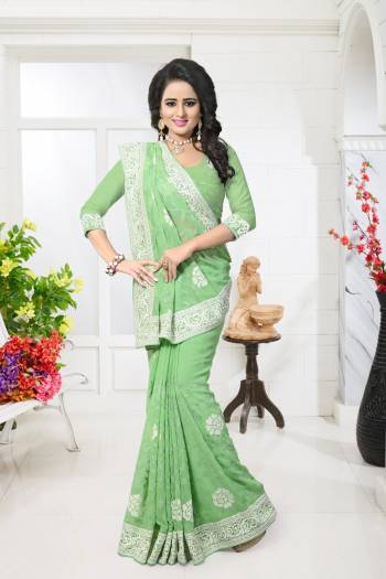 Get Ready For the Next Wedding With This Lovely Saree In Light Green Color Paired With Light Green Colored Bottom And Dupatta. This Saree And Blouse Are Fabricated On Georgette. It Will Definetly Earn You Lots Of Compliments From Onlookers As It Has Heavy Thread Work All Over The Saree.