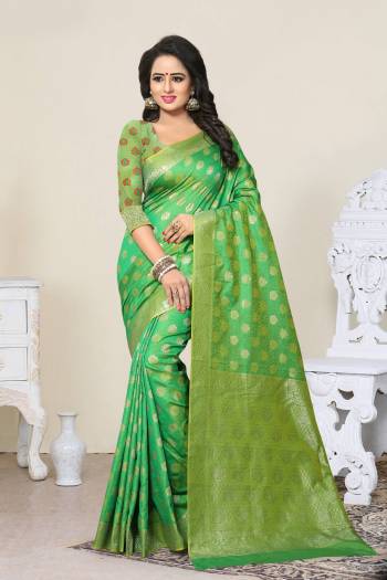 Grab This Saree In Green Color Paired With Green Colored Blouse. This Saree And Blouse Are Fabricated On Banarasi Art Silk Beautified With Weave All Over. This Saree Is Light In Weight And Easy To Drape. Buy Now.