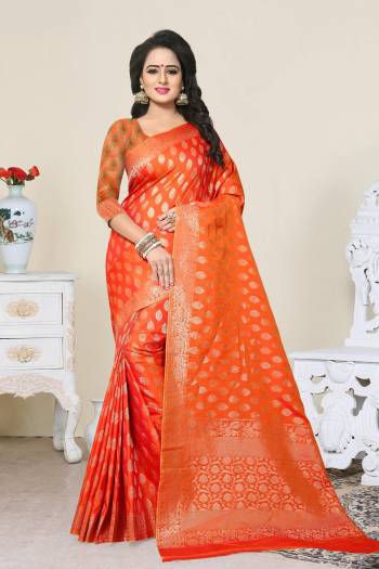 Shine Bright Wearing This Saree In Bright Orange Color Paired With Orange Colored Blouse. This Saree And Blouse Are Fabricated On Banarasi Art Silk Beautified With Weave. It Is Easy To Drape And Durable.