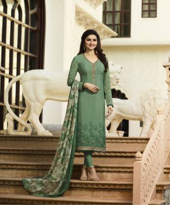 Simple And Elegant Looking Designer Straight Cut Suit Is Here In Sea Green Color Paired With Sea Green Colored Bottom And Dupatta. Its Top And Bottom are Fabricated On Crepe Paired With Chiffon Dupatta. Its Has Printed Dupatta With Embroidered Top.