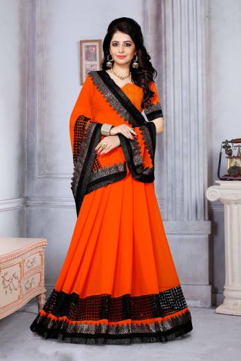 Orange Color Induces Perfect Summery Appeal To Any Outfit, So Grab This Attractive Saree In Orange Color Paired With Orange Colored Blouse. This Saree Is Fabricated On Chiffon Paired With Art Silk Fabricated Blouse Beautified With Fancy Lace Border.