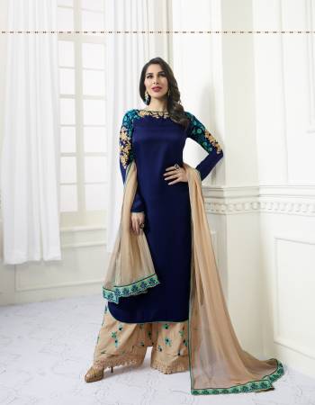 Attract All Wearing This Plazzo Suit In Rayol Blue Colored Top Paired With Beige Colored Plazzo And Dupatta. Its Top Is Fabricated On Satin Paired With Santoon Plazzo And Chiffon Dupatta . This Designer Suit Has Minimal Embrodiery Which Looks Pretty Elegant.