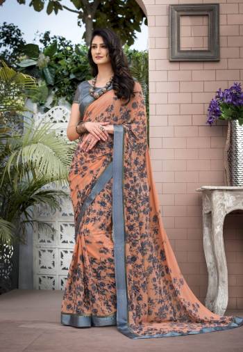 Beautiful Shade OF Orange Is Here With This Saree In Light Orange Color Paired With Grey Colored Blouse. This Saree Is Fabricated On Georgette Paired With Satin Fabricated Blouse. It Is Light Weight, Easy To Drape And Durable.