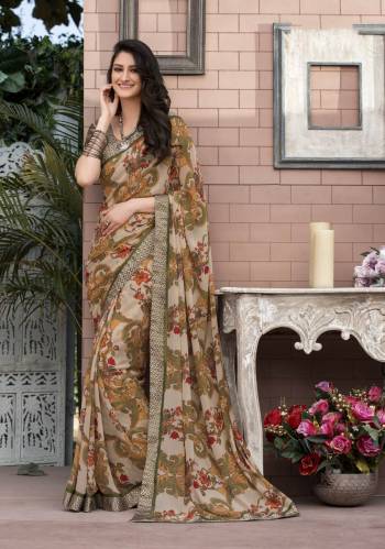 Combination Of Rich And Elegant Colors Is Here With This pretty Multi Colored Saree Paired With Grey Colored Blouse. This Saree Is Fabricated On Georgette Paired With Satin Fabricated Blouse. It Has Bold Prints Which Look More Attractive When You Drape It.