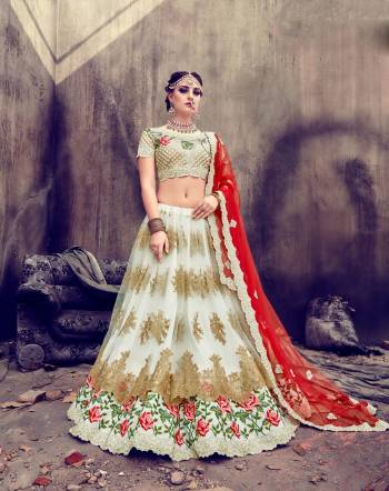 Here Is A Designer Lehenga Choli That Will Give Your Personality A Royal Look Like Never Before. Its Blouse Is Fabricated On Art Silk Paired With Net Lehenga And Net Dupatta. Its Blouse, Lehenga And Dupatta Are Fabricated On Net. Grab Everyones Attention Wearing This Lehenga Choli At The Next Wedding You Attend. 