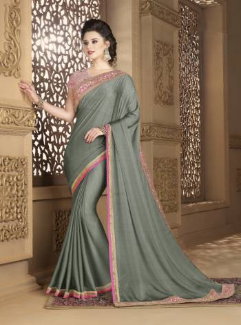 Here Is A Beautiful Saree That You Can Not Resist To Wear It Again And Again. Grab This Elegant Looking Saree In Grey Color Paired With Baby Pink Colored Blouse. This Saree Is Fabricated On Chiffon Paired With Net Fabricated Blouse. Both Its Fabrics Are Light Weight And Easy To Carry All Day Long.