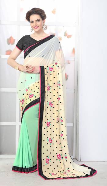 Here Is A Beautiful Designer Saree For The Function You Attend. Grab This Saree In White And Pastel Green Color Paired With Black Colored Blouse. This Saree Is Fabricated On Georgette Paired With Art Silk And Net Fabricated Blouse. It Has Colorful Embroidery Making The Saree Attractive.