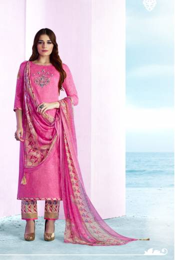 Celebrate This Festive Season Wearing This Straight Cut Suit In Pink Color Paired With Pink Colored Bottom And Dupatta. Its Top And Bottom Are Fabricated On Cotton paired With Chiffon Dupatta. It Has Prints All Over And Thread Work Over The Neckline. 