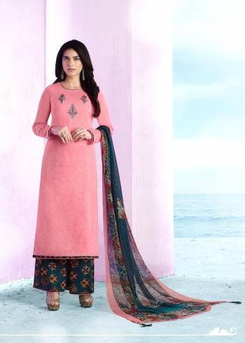 Earn Lots Of Compliments Wearing This Straight Cut Suit In Light Pink Colored Top Paired With Contrasting Blue Colored Bottom And Dupatta. Its Top And Bottom Are Fabricated On Cotton Paired With Chiffon Dupatta. It Is Beautified With Prints And Thread Work Over Neckline.