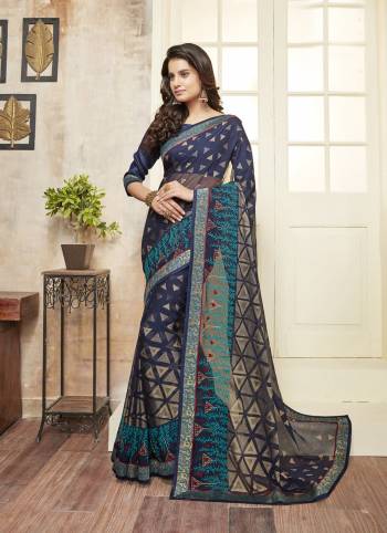 Enhance Your Personality Wearing This Saree In Navy Blue Color Paired With Navy Blue Colored Blouse. This Saree Is Fabricated On Chiffon Paired With Art Silk Fabricated Blouse. It Is Beautified With Embroidery All Over It Border.