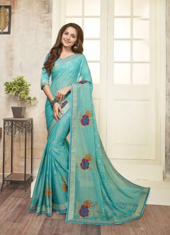 Simple And Elegant Looking Saree Is Here In Sky Blue Color Paired With Sky Blue Colored Blouse. This Saree Is Fabricated On Chiffon Paired With Art Silk Fabricated Blouse. It Has Prints And Bold Floral Embroidery. Buy Now.