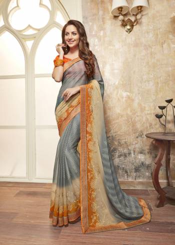 Saree In Grey Always Looks Pretty Amazing, So Grab This Saree In Grey Color Paired With Contrasting Orange Colored Blouse. This Saree Is Fabricated On Chiffon Paired With Art Silk Fabricated Blouse. It Is Light Weight And Easy To Carry All Day Long.