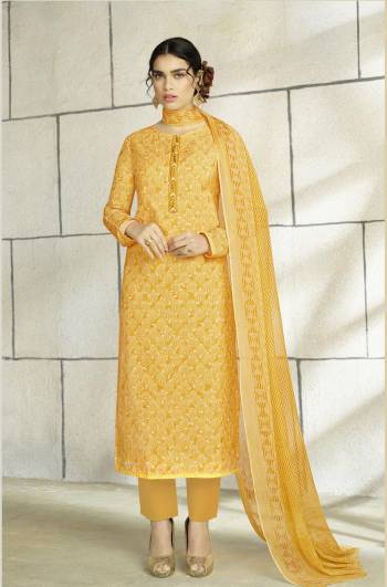 Here Is A Dress Material To Add Into Your Wardrobe For Casual Gatherings. It Top Is In Yellow Color Paired With Yellow Colored Bottom And Dupatta. Its Top and Bottom Are Fabricated On Cotton Paired with Chiffon Dupatta. It Is Beautified With Prints All Over With Thread Embroidery At The Neck.