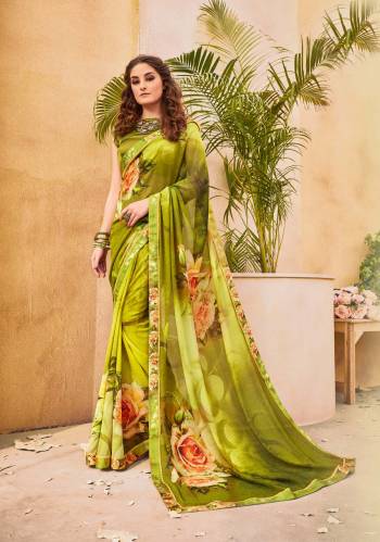 Grab This Shaded Green Colored Saree Paired With Dark Green Colored Blouse. This Saree Is Fabricated On Georgette Paired With Satin Fabricated Blouse. It Is Beautified With Prints All Over. Buy It Now.