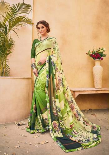 Grab This Shaded Green Colored Saree Paired With Dark Green Colored Blouse. This Saree Is Fabricated On Georgette Paired With Satin Fabricated Blouse. It Is Beautified With Prints All Over. Buy It Now.