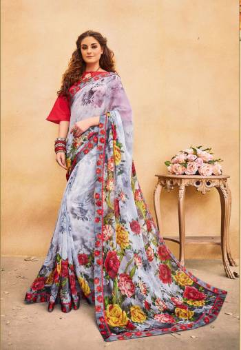 Go Floral Wearing This Saree In Grey Color Beautified with Multi Colored Floral Prints, Paired With Red Colored Blouse. This Saree Is Fabricated On Georgette Paired With Art Silk Fabricated Blouse. It Is Light Weight And Easy To Carry All Day Long.