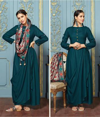 New And Unique Shade Of Blue Is Here With This Readymade Kurti In Teal Blue Color Fabricated On Rayon Cotton. It Is Paired With Multi Colored Scarf Fabricated On Silk Satin. Grab This Designer Kurti And Earn Lots Of Compliments From Onlookers.