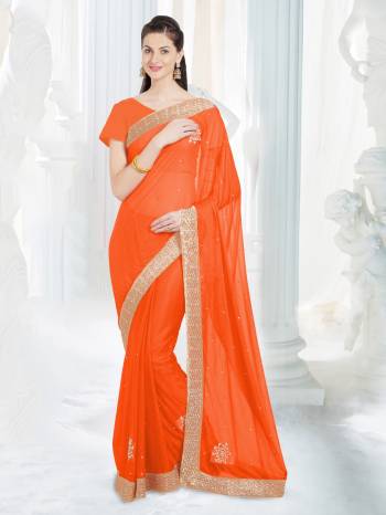 Shine Bright Wearing This Saree In Orange Color Paired With Orange Colored Blouse. This Saree Is Fabricated On Net Lycra Paired With Art Silk Fabricated Blouse. It Has Embroidered Lace Border With Stone Work.